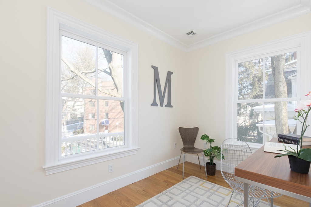 26 Parker Street Cambridge, MA 02138 - Photo 22 of 29 a living room with furniture and a window