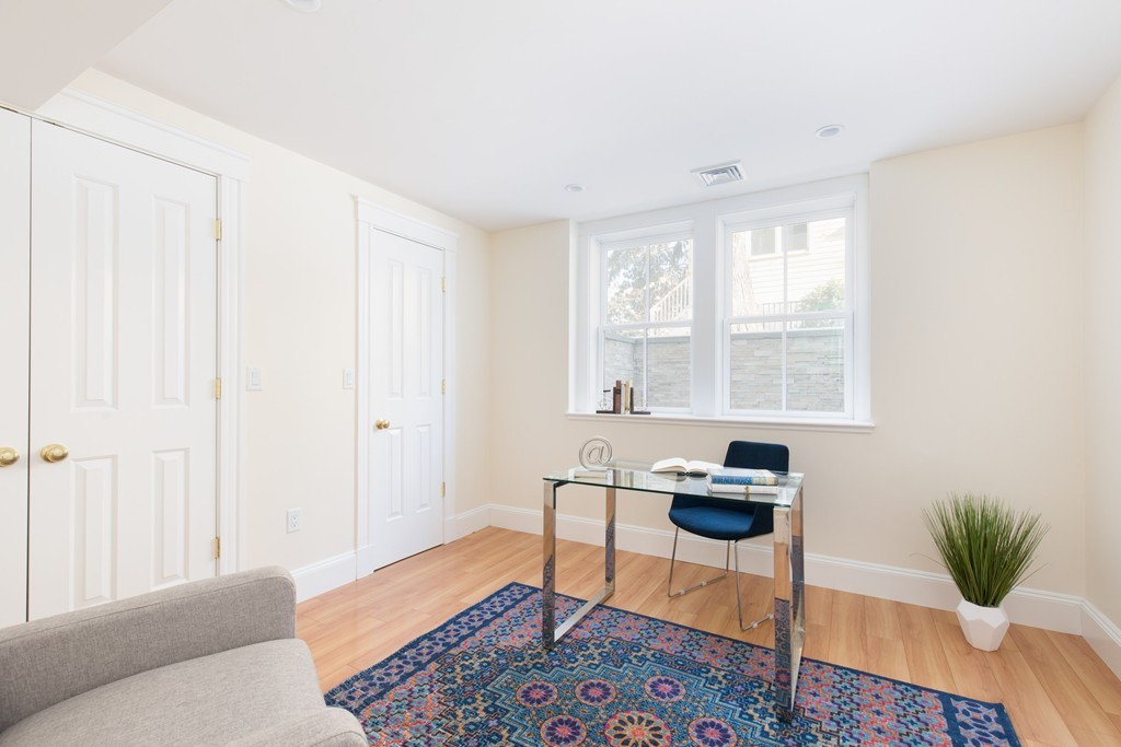 26 Parker Street Cambridge, MA 02138 - Photo 25 of 29 a living room with furniture and a window