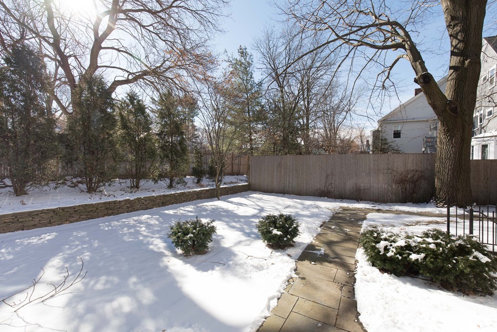 26 Parker Street Cambridge, MA 02138 - Photo 28 of 29 a backyard of a house with lots of green space