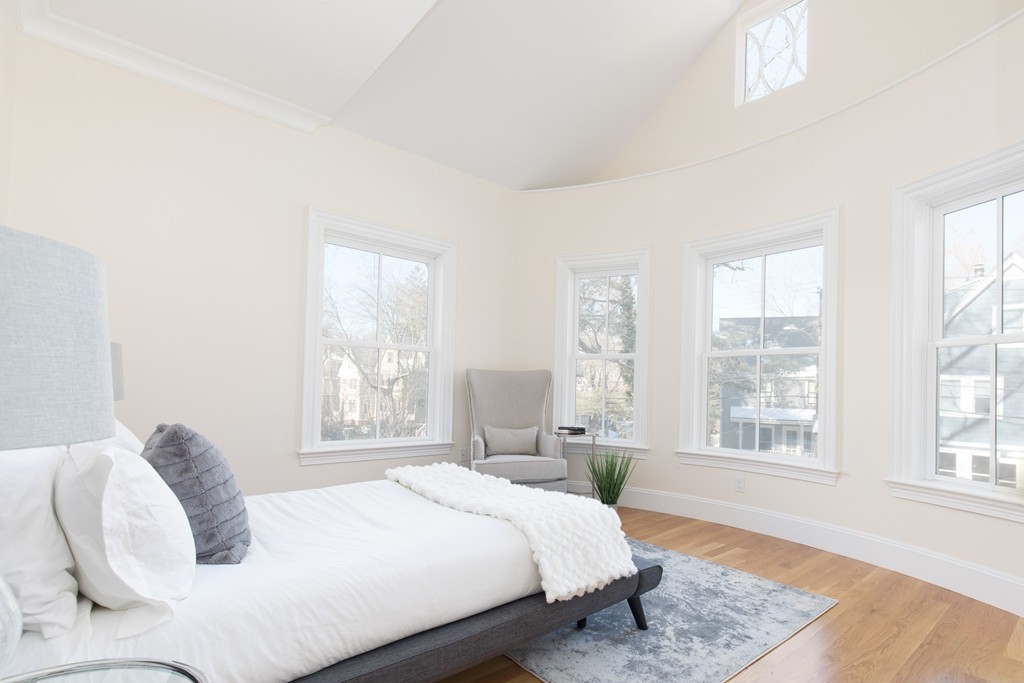 26 Parker Street Cambridge, MA 02138 - Photo 29 of 29 a bedroom with a bed and wooden floor