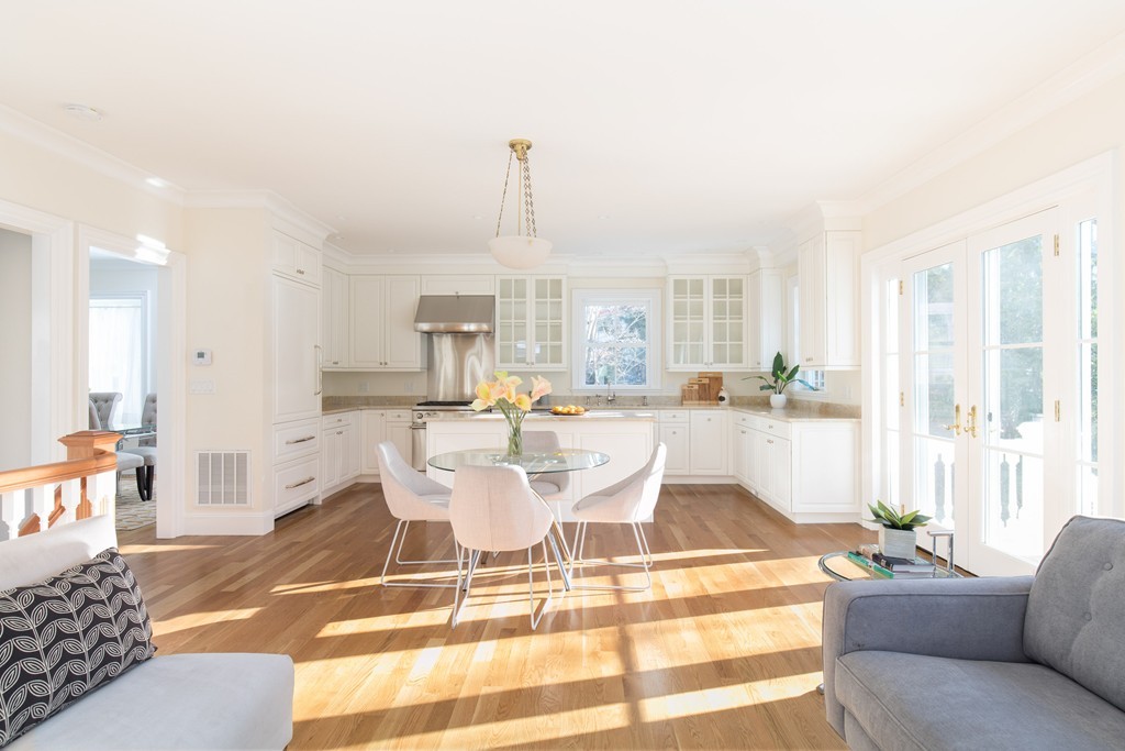 26 Parker Street Cambridge, MA 02138 - Photo 4 of 29 a living room with a patio fireplace furniture and a large window
