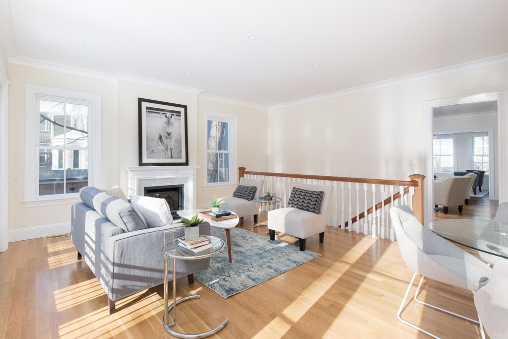 26 Parker Street Cambridge, MA 02138 - Photo 8 of 29 a living room with fireplace furniture and floor to ceiling windows