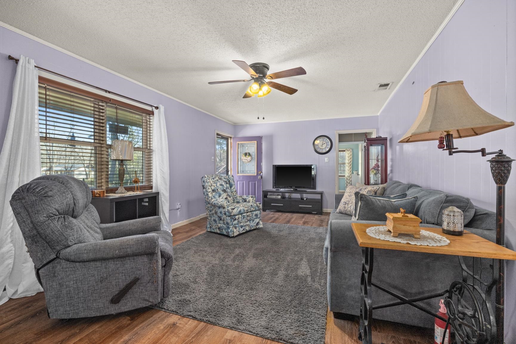 163 Michelle Street Burlison, TN 38015 - Photo 3 of 13 a living room with furniture and wooden floor