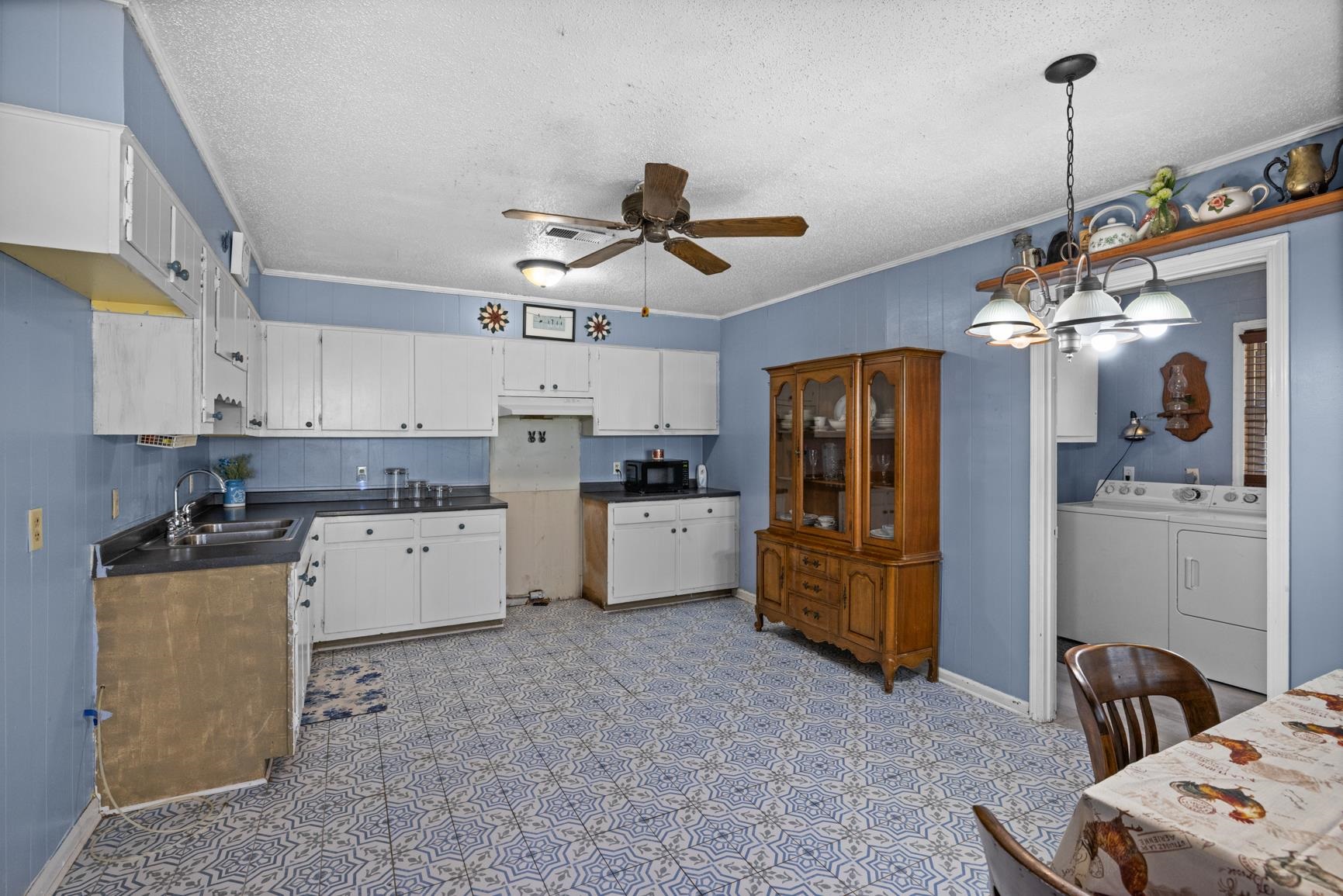 163 Michelle Street Burlison, TN 38015 - Photo 5 of 13 a kitchen that has a lot of cabinets a sink and appliances