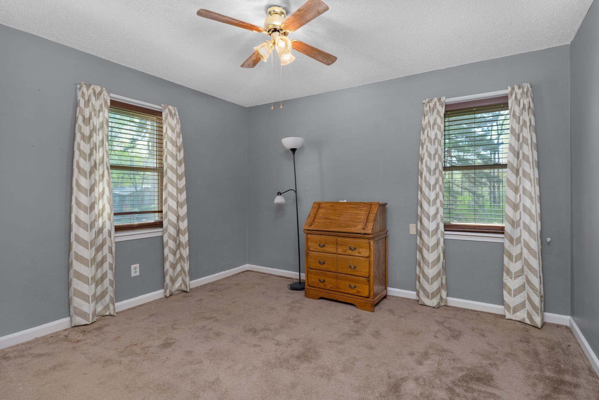 163 Michelle Street Burlison, TN 38015 - Photo 7 of 13 a view of room with window and a ceiling fan