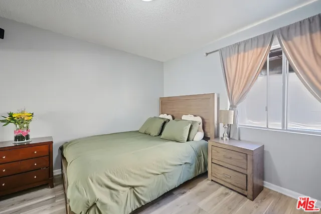a bathroom with a granite countertop sink mirror and vanity