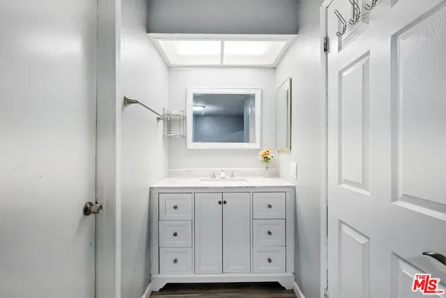 a bathroom with a sink and a mirror