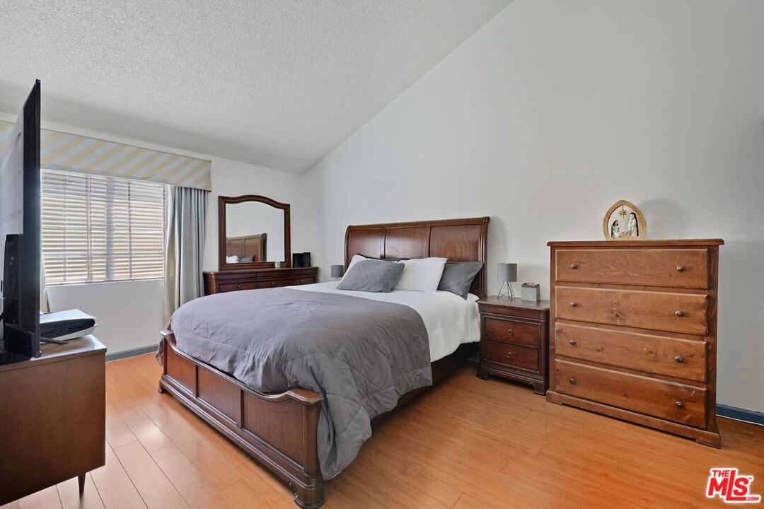 7422 Hazeltine Avenue, Unit 3 Van Nuys, CA 91405 - Photo 21 of 36 a bedroom with a bed and with furniture