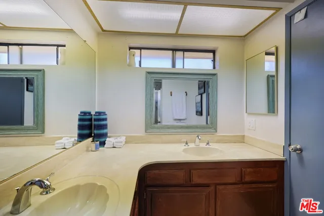 a bathroom with a toilet sink and shower