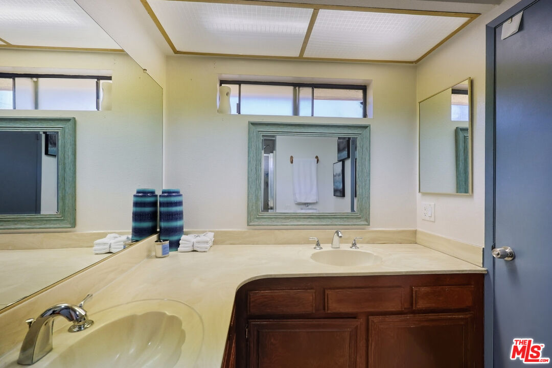 7422 Hazeltine Avenue, Unit 3 Van Nuys, CA 91405 - Photo 23 of 36 a bathroom with a sink and a mirror