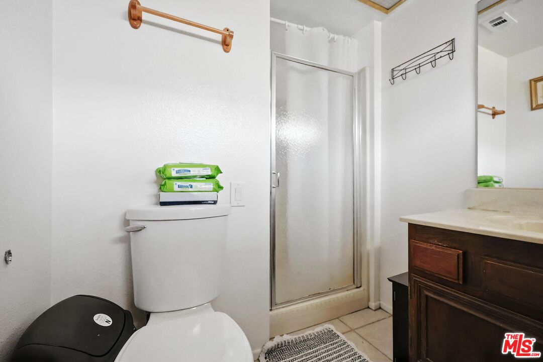 7422 Hazeltine Avenue, Unit 3 Van Nuys, CA 91405 - Photo 24 of 36 a bathroom with a toilet sink and shower