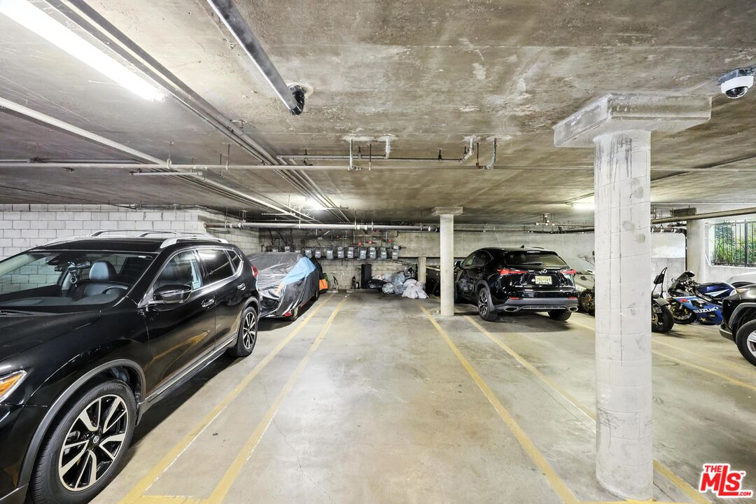 7422 Hazeltine Avenue, Unit 3 Van Nuys, CA 91405 - Photo 26 of 36 a view of parking garage with cars