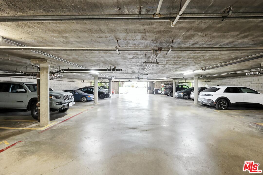 7422 Hazeltine Avenue, Unit 3 Van Nuys, CA 91405 - Photo 27 of 36 a view of parking garage with cars