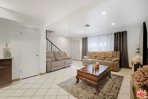 a living room with furniture and a table