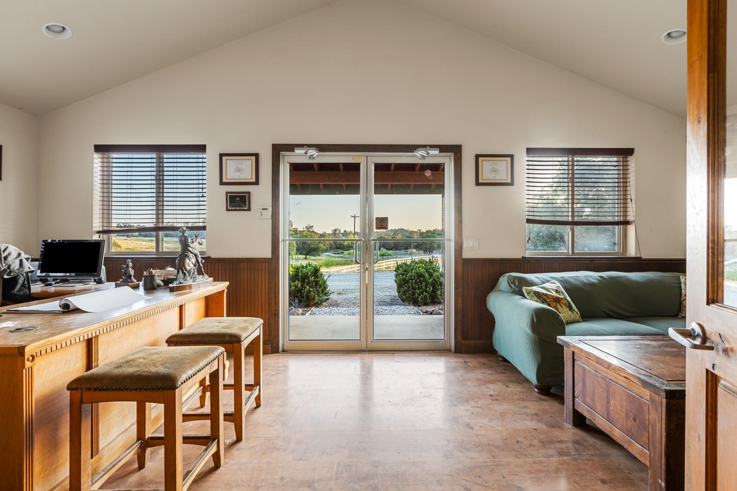 20945 Bear Hollow Road Grass Valley, CA 95949 - Photo 20 of 82 a living room with furniture and a floor to ceiling window