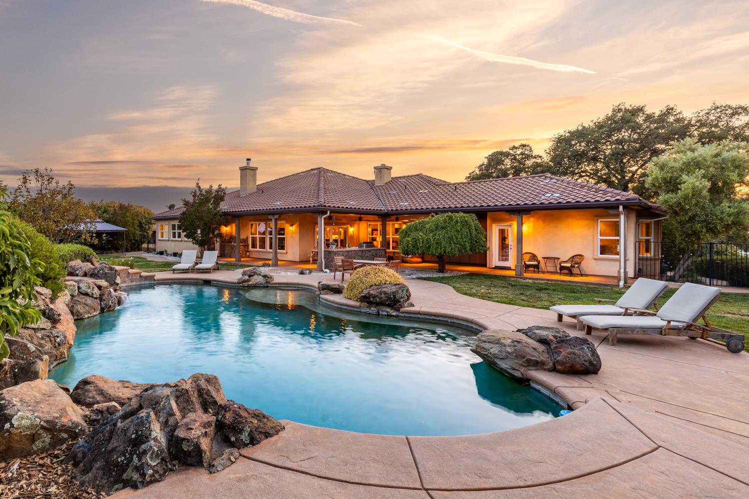 20945 Bear Hollow Road Grass Valley, CA 95949 - Photo 2 of 82 a view of swimming pool with outdoor seating and a garden