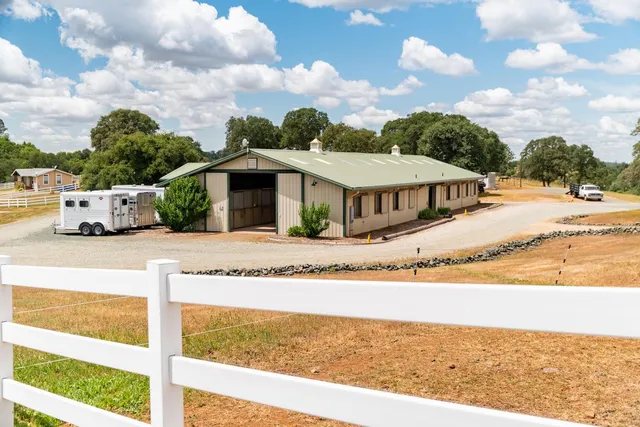 a living room with furniture a window and a flat screen tv