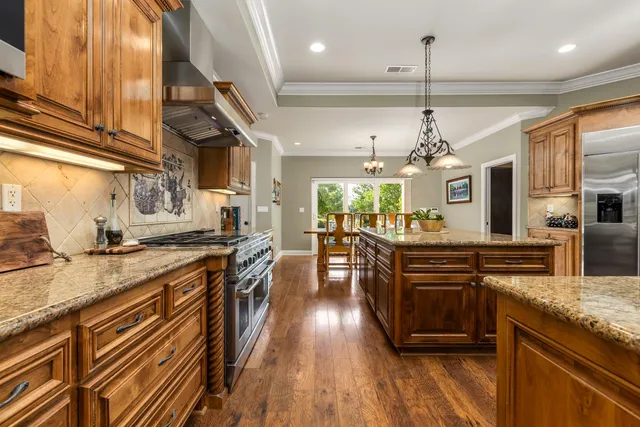 a bedroom with a bed a flat screen tv and a large window
