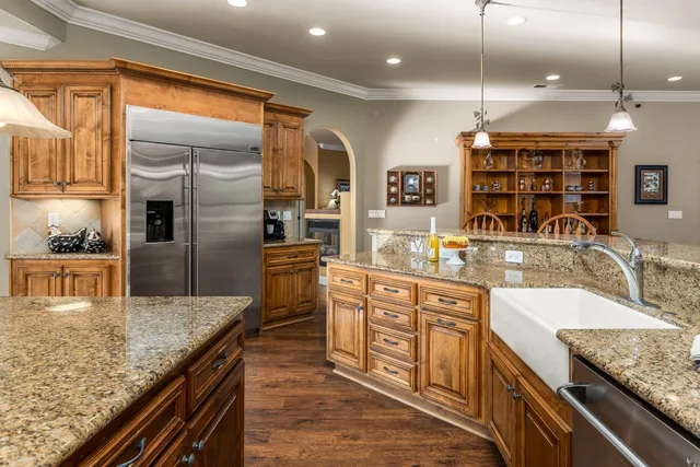 a bathroom with a double vanity sink a mirror a vanity and a shower