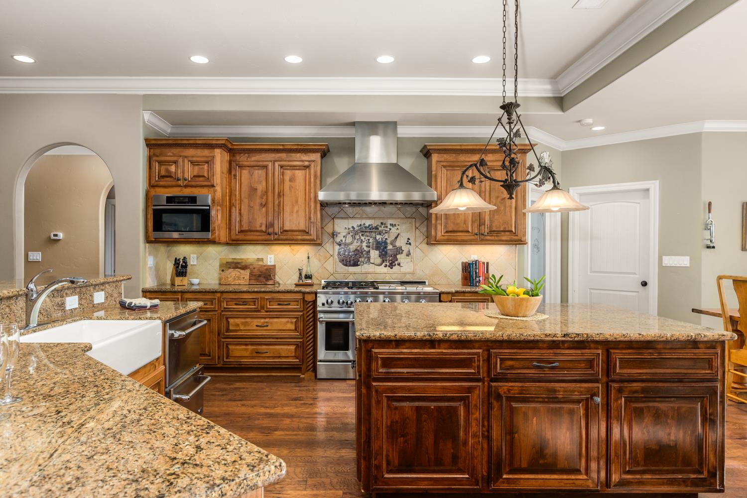 20945 Bear Hollow Road Grass Valley, CA 95949 - Photo 41 of 82 a kitchen with stainless steel appliances granite countertop a stove and cabinets