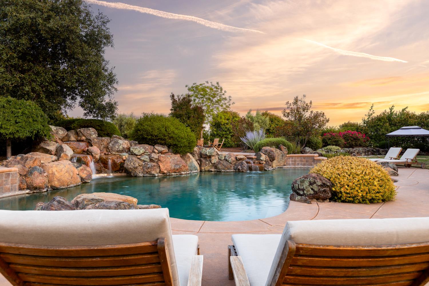 20945 Bear Hollow Road Grass Valley, CA 95949 - Photo 45 of 82 a view of a lake with couches and city view