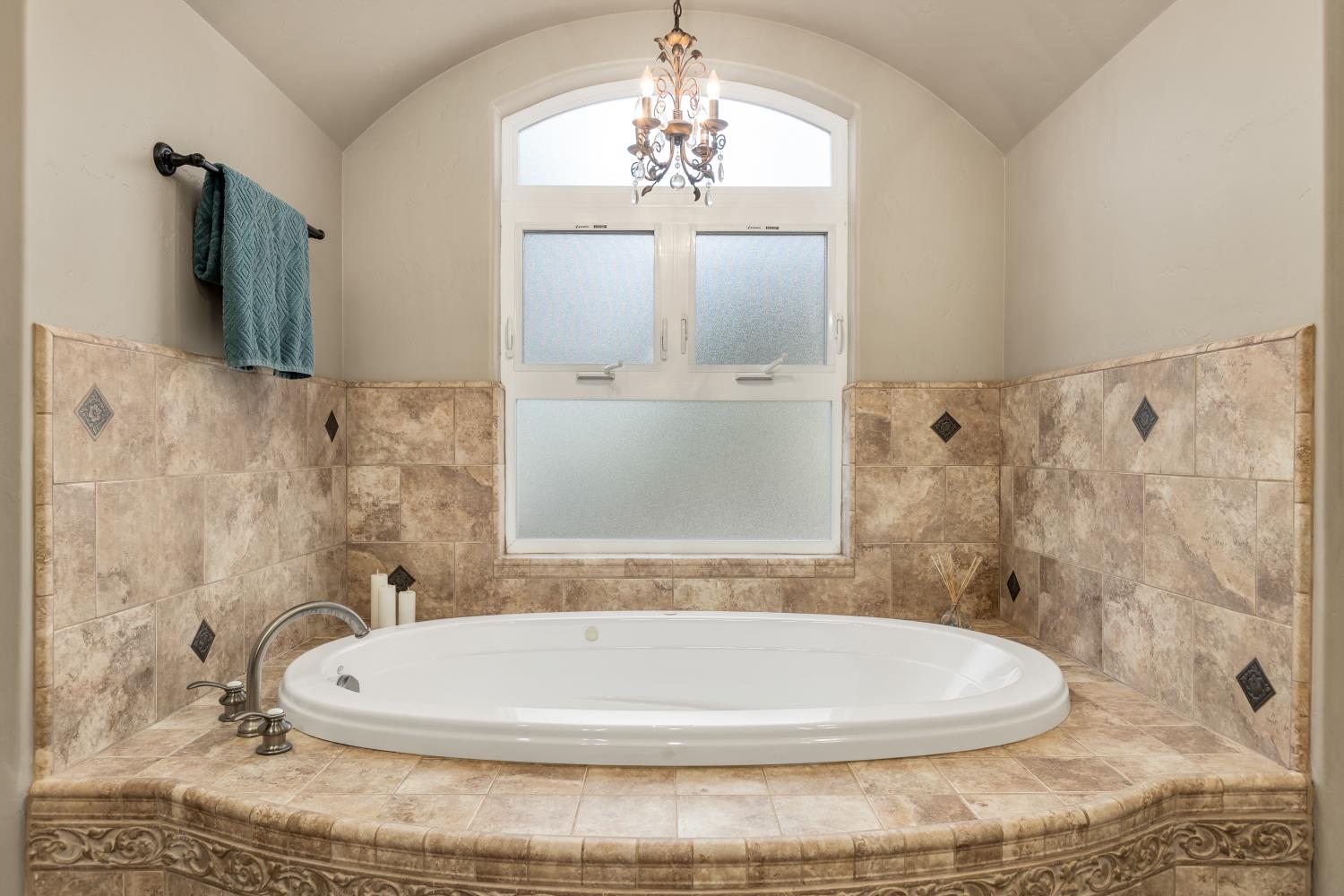 20945 Bear Hollow Road Grass Valley, CA 95949 - Photo 54 of 82 a white bath tub sitting in a bathroom next to a window