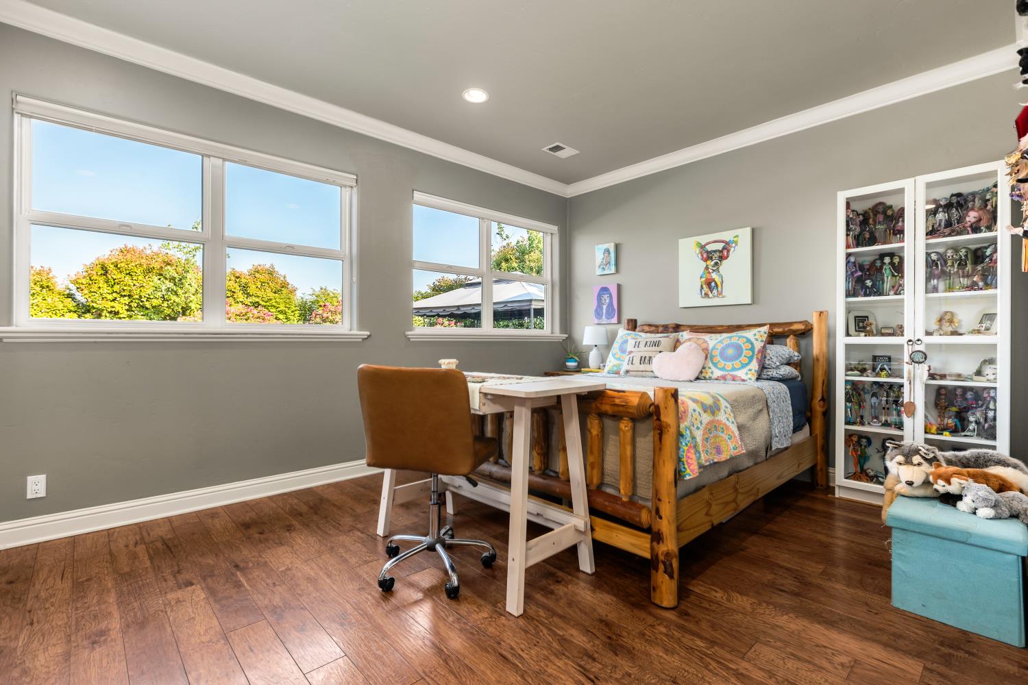 20945 Bear Hollow Road Grass Valley, CA 95949 - Photo 65 of 82 a bedroom with a bed and a chair