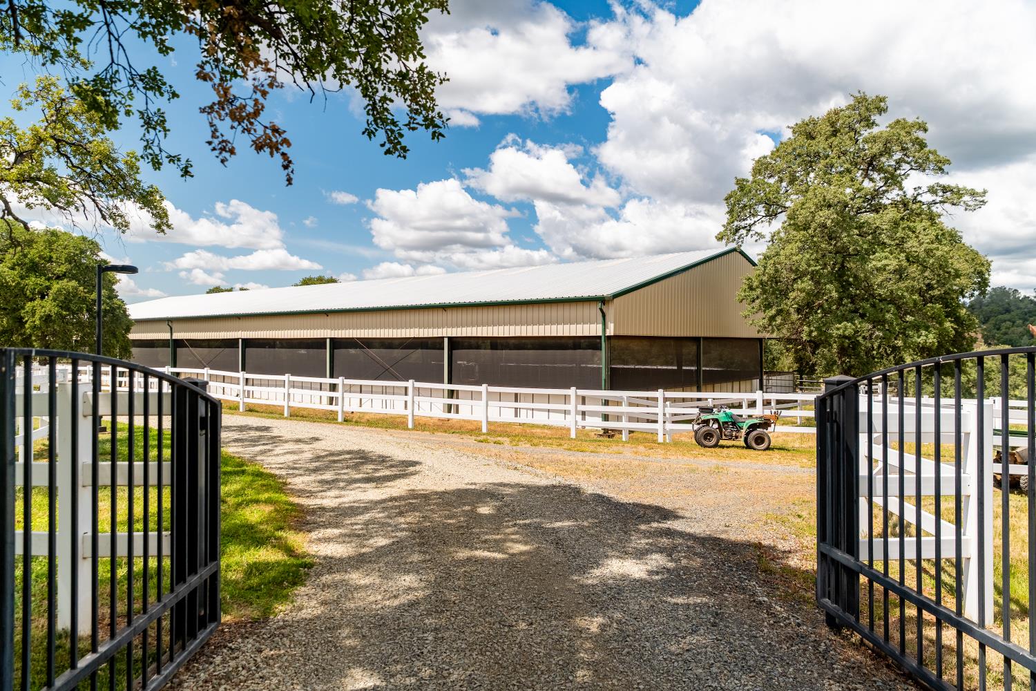 20945 Bear Hollow Road Grass Valley, CA 95949 - Photo 73 of 82 a view of a swimming pool with a lawn chairs under an umbrella