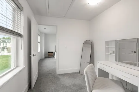 a view of room with window and bathroom