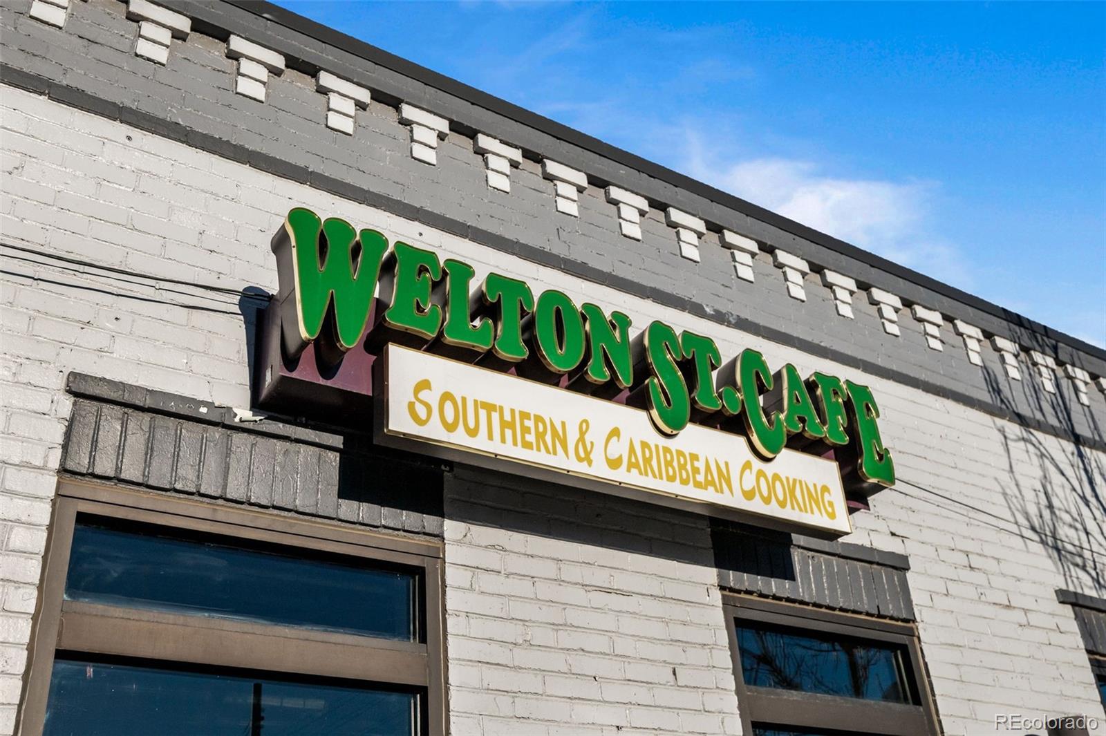 2922 Welton Street Denver, CO 80205 - Photo 27 of 42 a street sign on a wooden wall