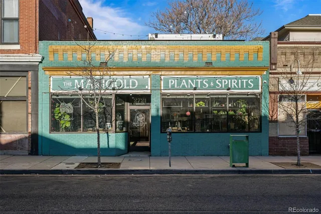 a view of a street with stores