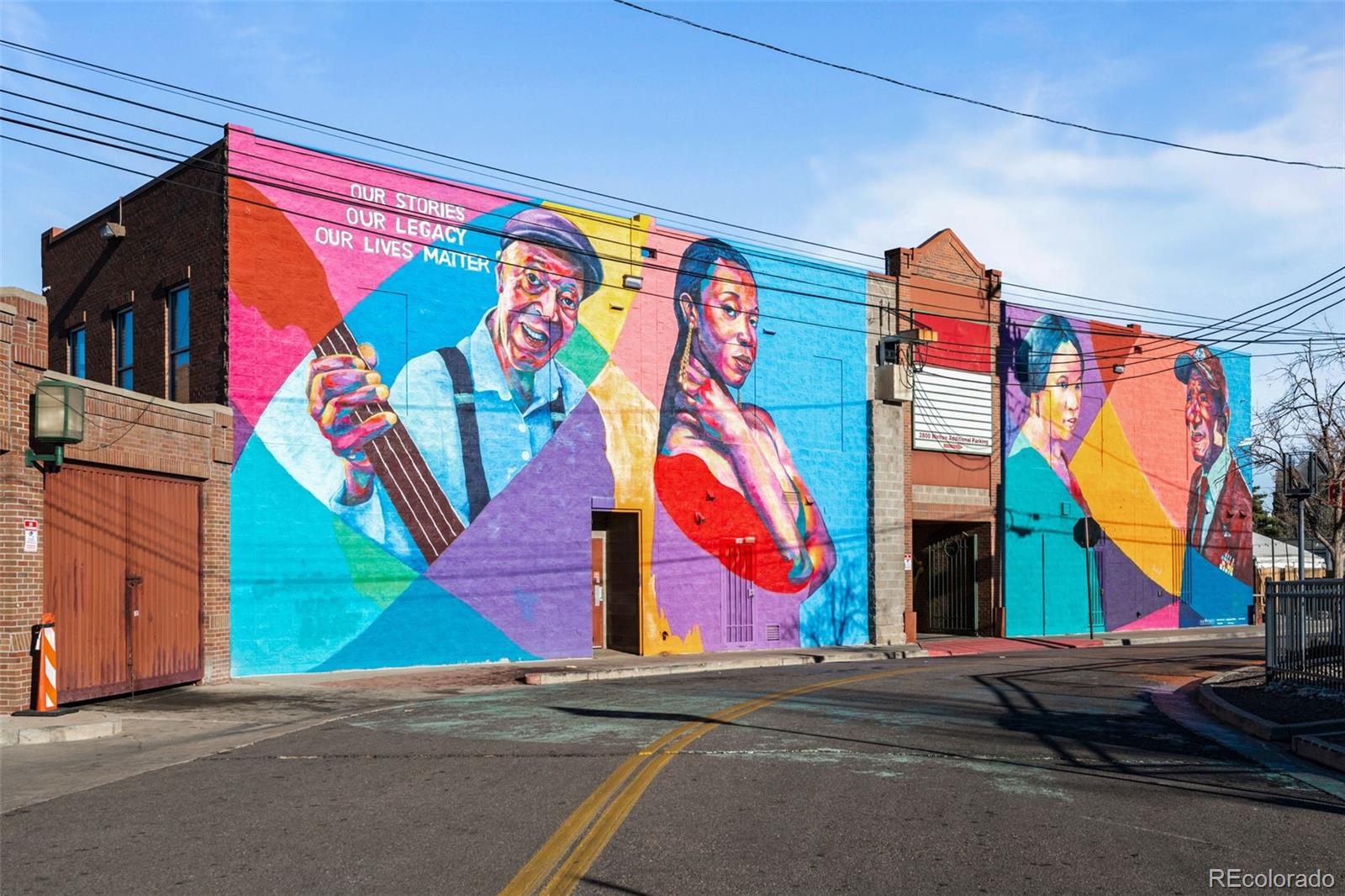 2922 Welton Street Denver, CO 80205 - Photo 42 of 42 a view of a street with tall buildings