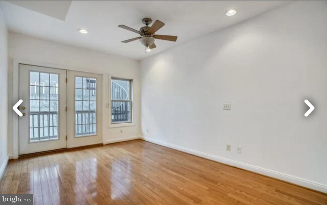 111 East Cross Street Baltimore, MD 21230 - Photo 12 of 36 a view of an empty room with a window and wooden floor