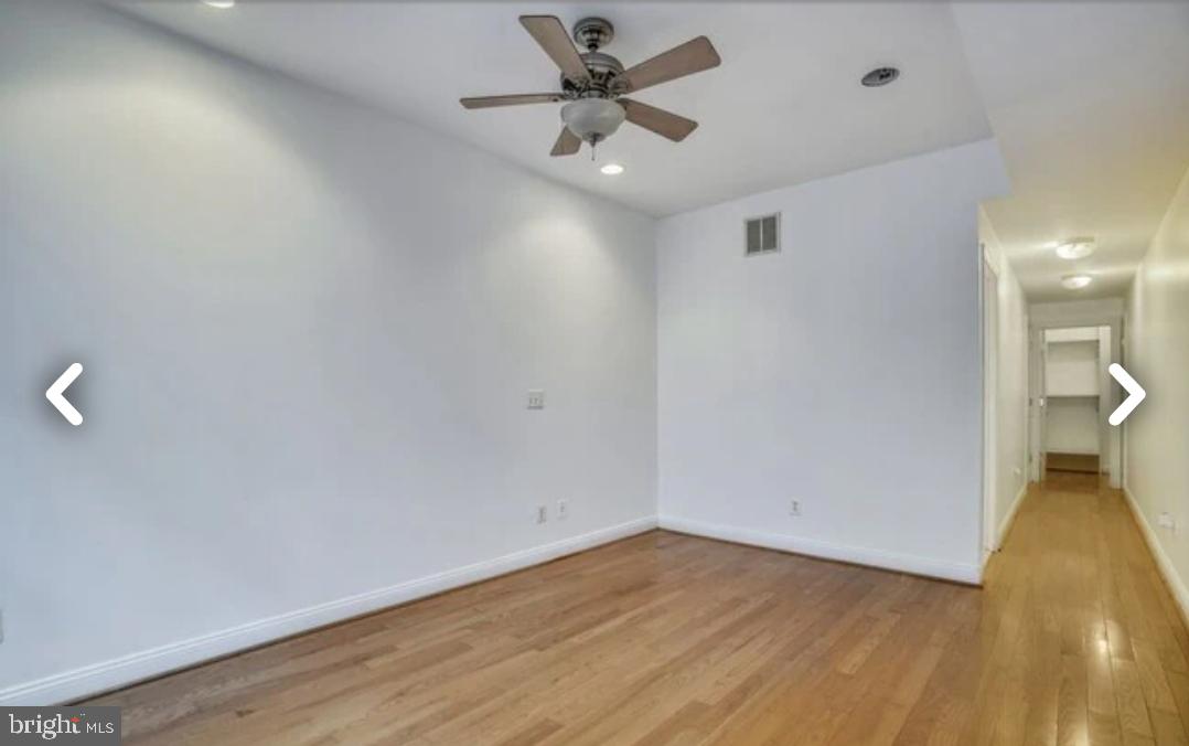 111 East Cross Street Baltimore, MD 21230 - Photo 13 of 36 a view of a livingroom with a ceiling fan and wooden floor