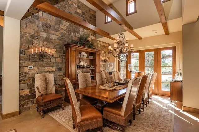 a room with a bed and a chandelier