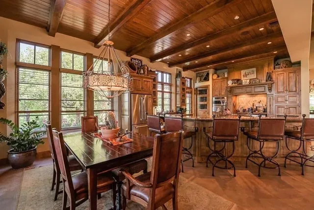 a view of a patio with table and chairs and potted plants