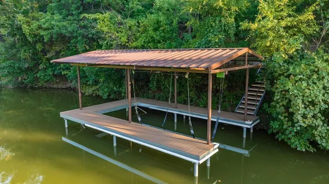 a view of a house with backyard and porch