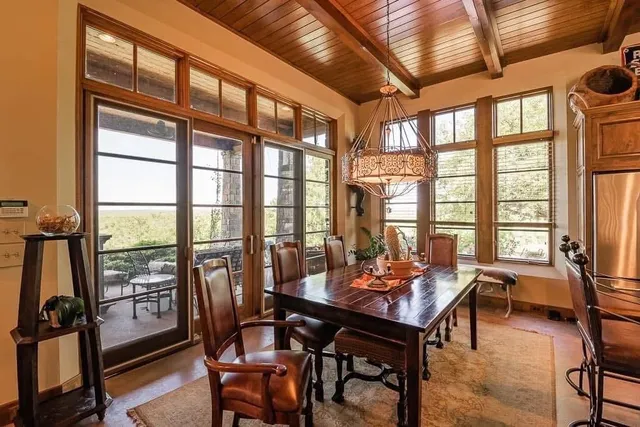 a spacious bedroom with a large window and a couch