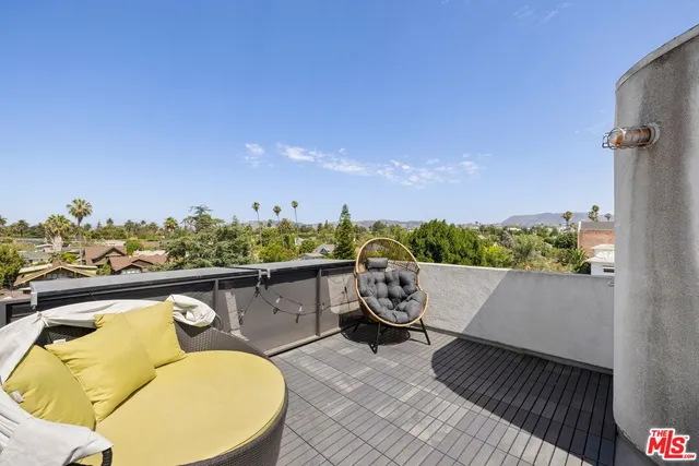 a view of a swimming pool with furniture
