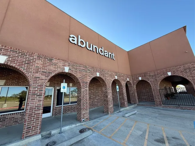 a front view of a house with large windows