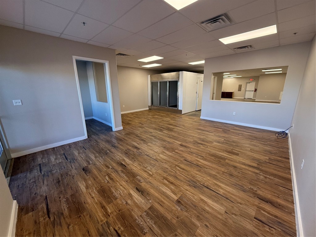 1101 Bunton Creek Road Kyle, TX 78640 - Photo 2 of 17 a view of an empty room with wooden floor and staircase