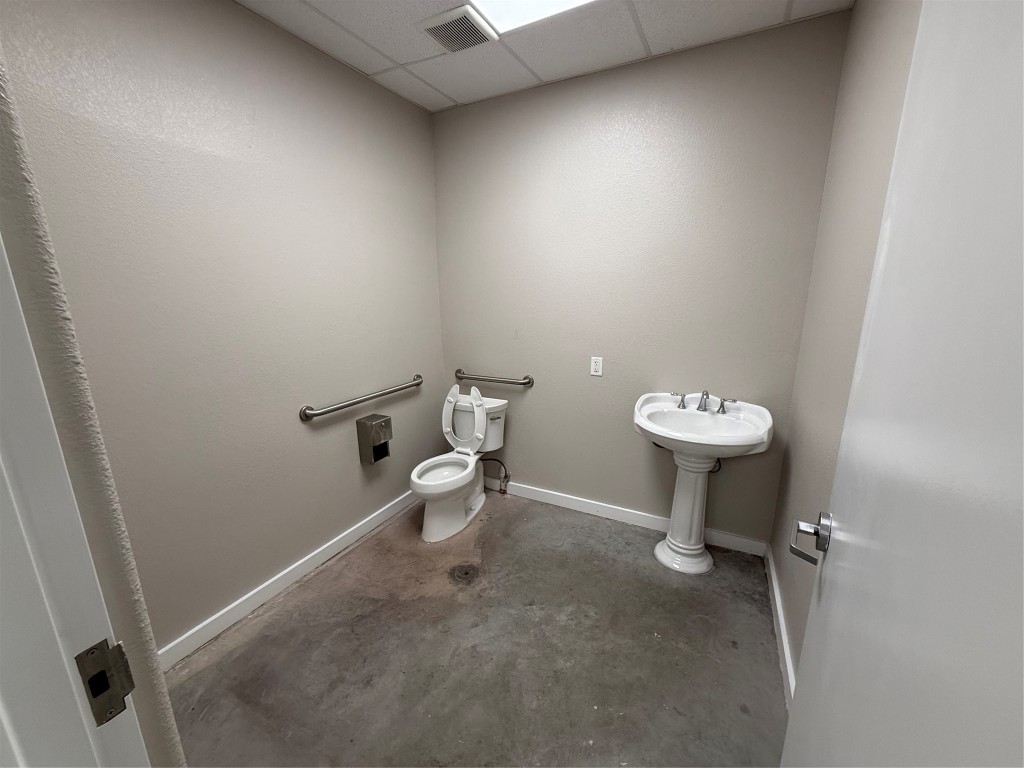 1101 Bunton Creek Road Kyle, TX 78640 - Photo 7 of 17 a white toilet sitting next to a white sink