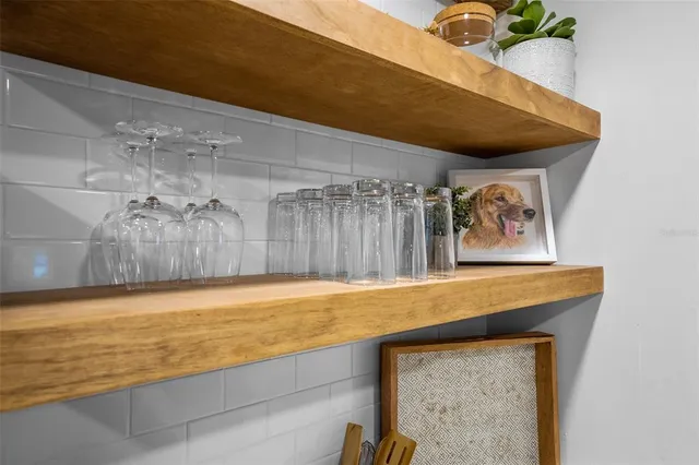 a view of a room with painting on the wall