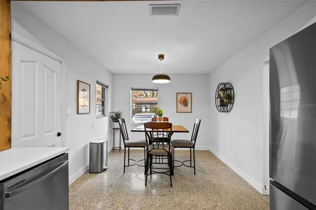 a view of a dining room with furniture