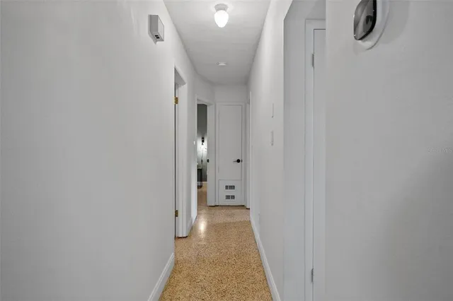 a view of a hallway with white walls