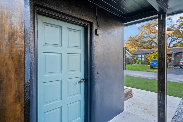 a view of a door and wooden floor