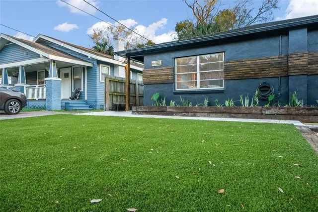 a view of a house with a yard porch and sitting area
