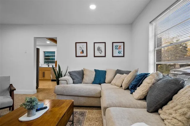 a living room with furniture and window