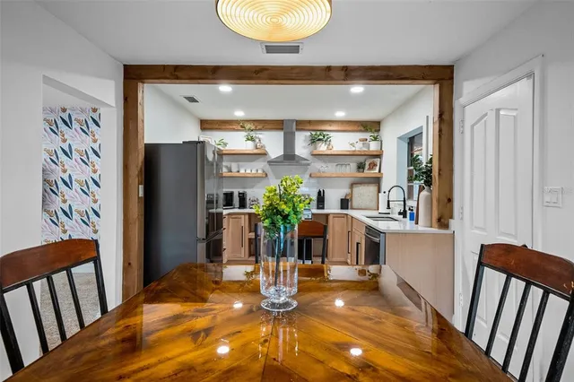 a view of kitchen with furniture and wooden floor