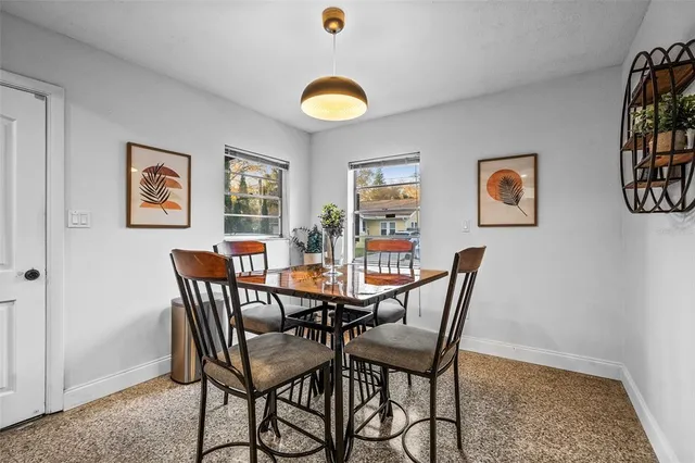 a view of a dining room with furniture